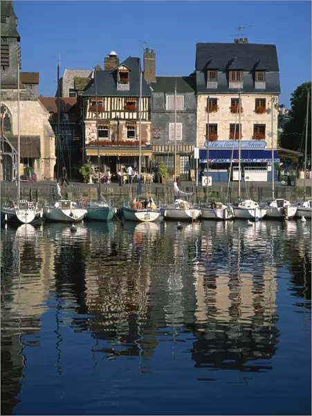 View across old harbour to restaurant on the St. Etienne Quay, at Honfleur