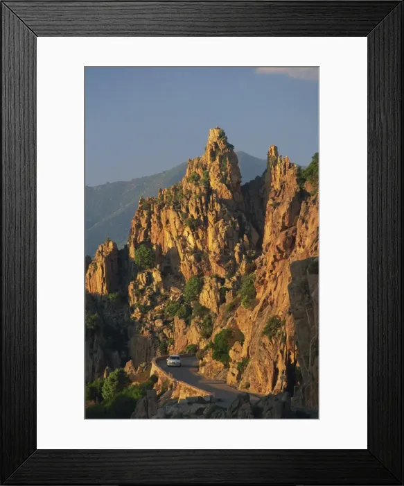 Framed Print : The Calanche, white granite rocks, with car on road below, near Piana, Corsica Framed Print : The Calanche, white granite rocks, with car on road below, near Piana, Corsica
