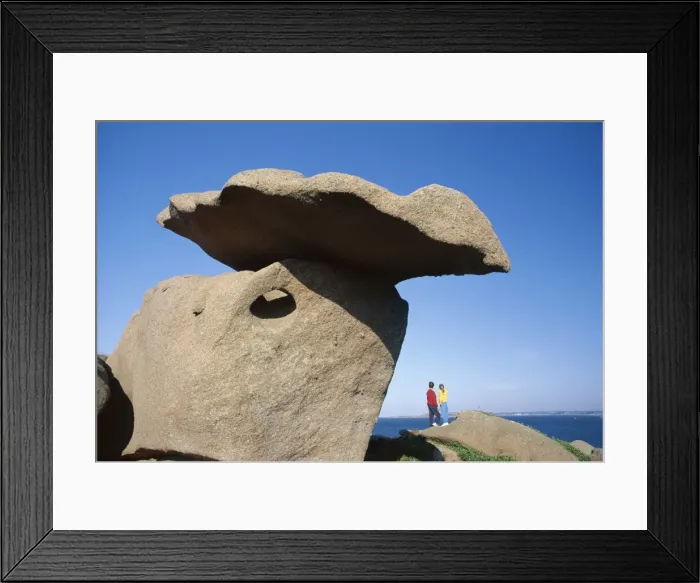 Framed Print : Two figures below precarious granite rocks, Ploumanach, Cotes d Armor Framed Print : Two figures below precarious granite rocks, Ploumanach, Cotes d Armor