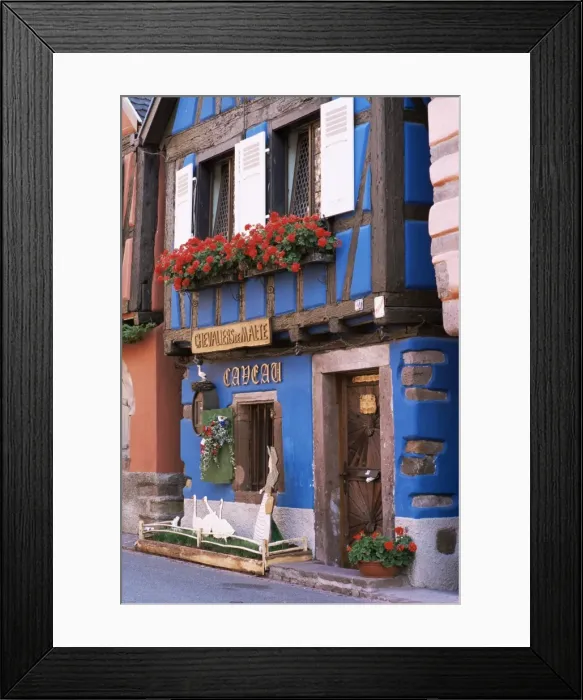 Framed Print : Blue house with windowbox full of geraniums, Niedermorschwihr, Haut-Rhin Framed Print : Blue house with windowbox full of geraniums, Niedermorschwihr, Haut-Rhin