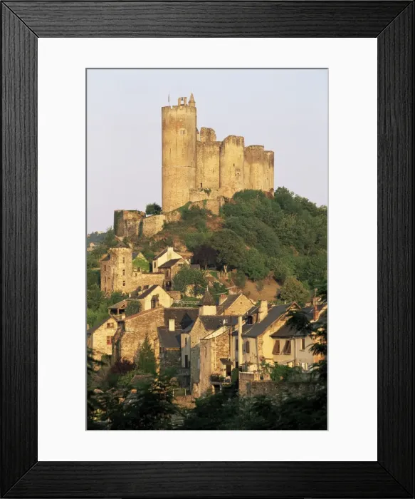 Framed Print : The castle towering above village houses, in early morning light, Najac Framed Print : The castle towering above village houses, in early morning light, Najac