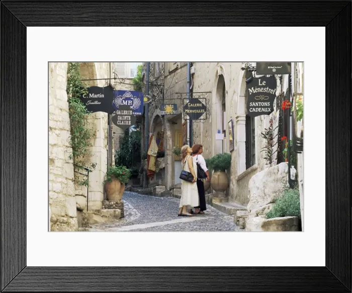 Framed Print : Window shopping in medieval village street, St. Paul de Vence, Alpes-Maritimes Framed Print : Window shopping in medieval village street, St. Paul de Vence, Alpes-Maritimes
