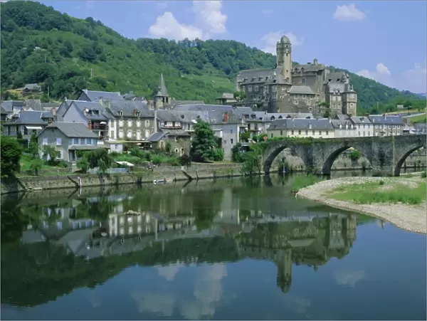 Village reflected in the Lot River, Estaing, Aveyron, Midi Pyrenees, France, Europe
