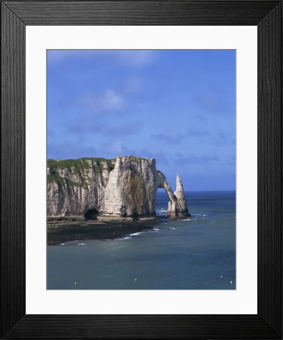 Framed Print : Cliffs and rock arch, known as the Falaises, on the coast near Etretat
