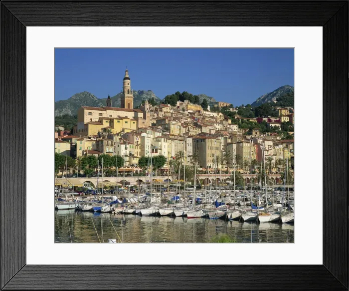 Framed Print : Boats in the harbour with the houses and church of the town of Menton behind Framed Print : Boats in the harbour with the houses and church of the town of Menton behind