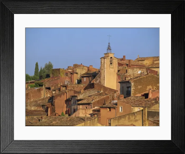 Framed Print : Church bell tower above the roofs of houses in the village of Roussillon in Provence