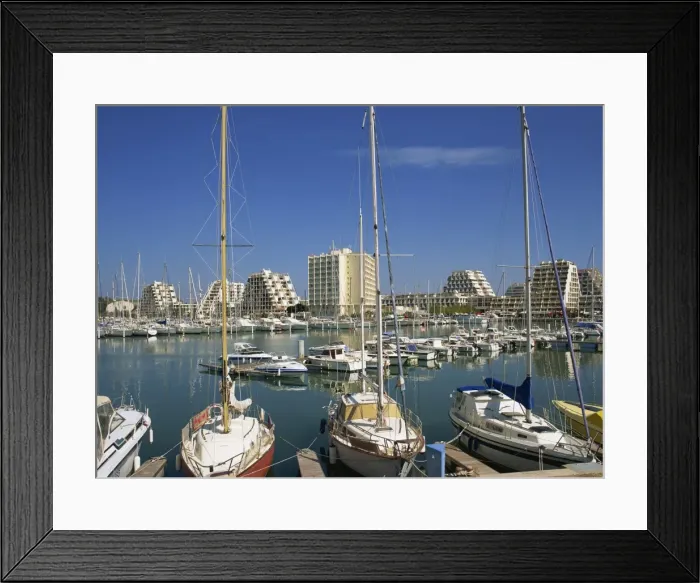 Framed Print : Boats in the harbour and modern buildings in the background, at La Grande Motte Framed Print : Boats in the harbour and modern buildings in the background, at La Grande Motte