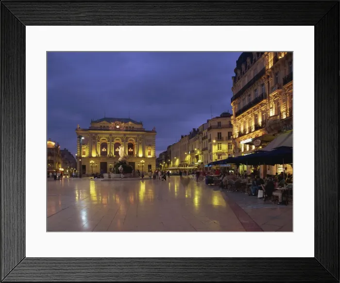Framed Print : Pavement cafes on the Place de la Comedie and illuminated buildings in Montpellier Framed Print : Pavement cafes on the Place de la Comedie and illuminated buildings in Montpellier