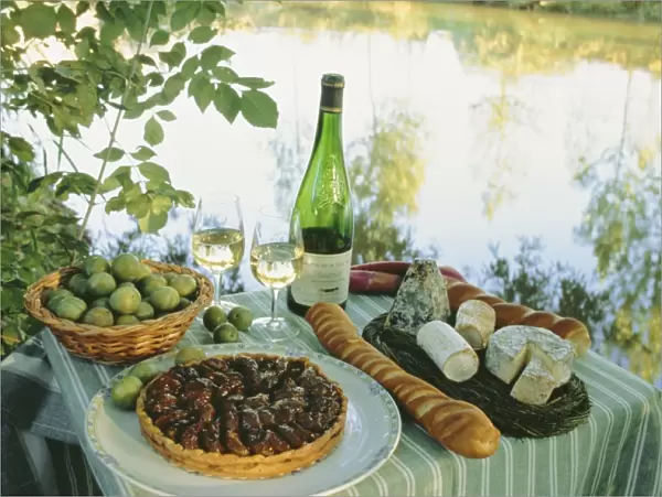 Food and wine on a table beside the river Loire, France, Europe