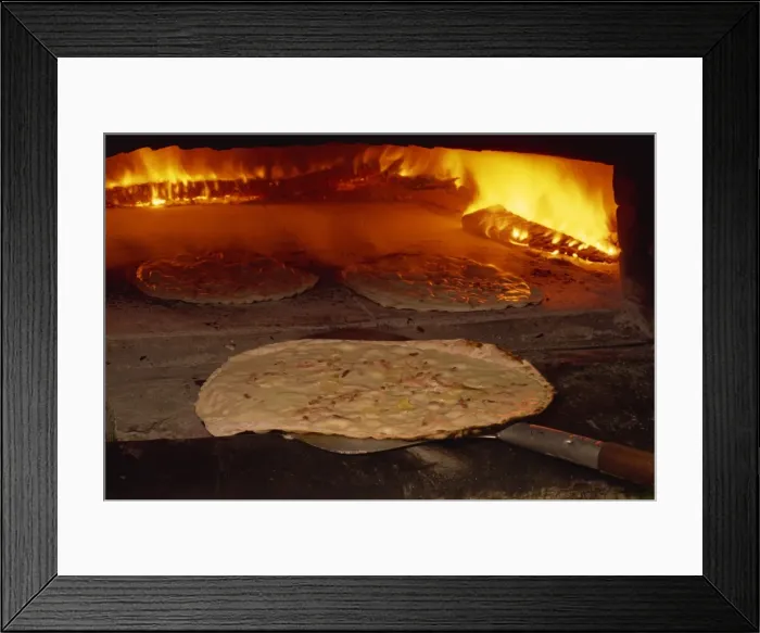 Framed Print : Tarte flambee going into the oven, in France, Europe Framed Print : Tarte flambee going into the oven, in France, Europe