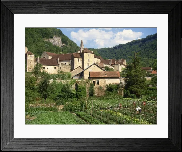 Framed Print : Man working in vegetable gardens below the village of Baume les Messieurs Framed Print : Man working in vegetable gardens below the village of Baume les Messieurs