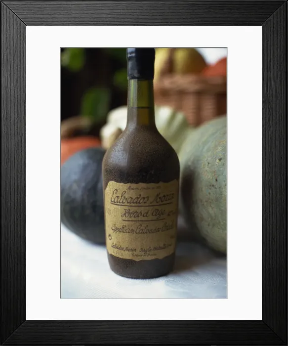 Framed Print : Close-up of an old bottle of Calvados from Normandy, France, Europe Framed Print : Close-up of an old bottle of Calvados from Normandy, France, Europe