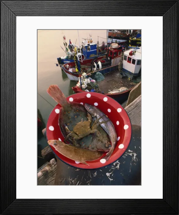 Framed Print : Bowl of fish and crab, and fishing boats in the background, at Boulogne Framed Print : Bowl of fish and crab, and fishing boats in the background, at Boulogne