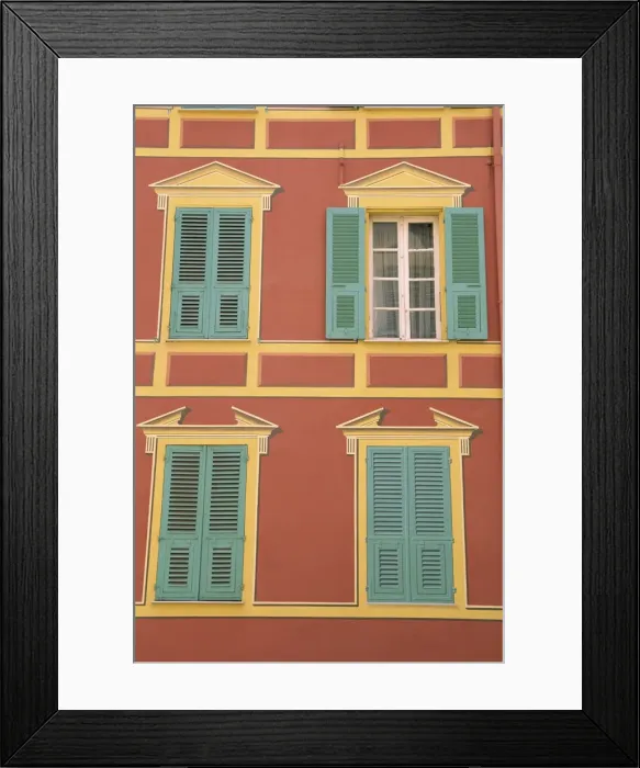 Framed Print : Exterior of a formal facade, brightly painted, with blue shutters and orange walls Framed Print : Exterior of a formal facade, brightly painted, with blue shutters and orange walls