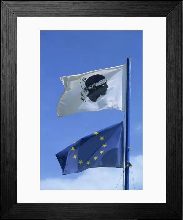 Framed Print : Close-up of the Corsican and European Union (EU) flags flying, Ajaccio Framed Print : Close-up of the Corsican and European Union (EU) flags flying, Ajaccio