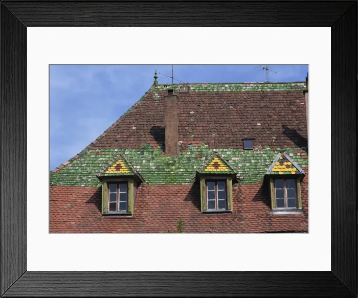 Framed Print : Dormer windows and decorative tiles on a typical roof in the old town of Ribeauville