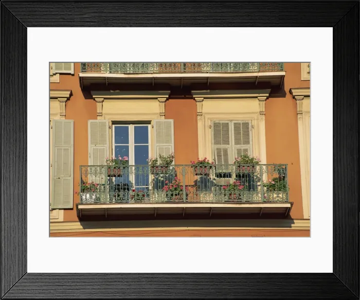 Framed Print : Detail of geraniums on a wrought iron balcony on an ochre coloured house in the Old Town of Nice Framed Print : Detail of geraniums on a wrought iron balcony on an ochre coloured house in the Old Town of Nice
