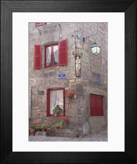 Framed Print : Statue of the Madonna and Child on a house with red shutters on a street corner in Besse en Chandesse, in the Auvergne Framed Print : Statue of the Madonna and Child on a house with red shutters on a street corner in Besse en Chandesse, in the Auvergne