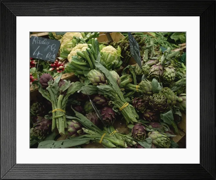 Framed Print : A display of vegetables, mainly artichokes and cauliflowers on a market stall in Normandy Framed Print : A display of vegetables, mainly artichokes and cauliflowers on a market stall in Normandy