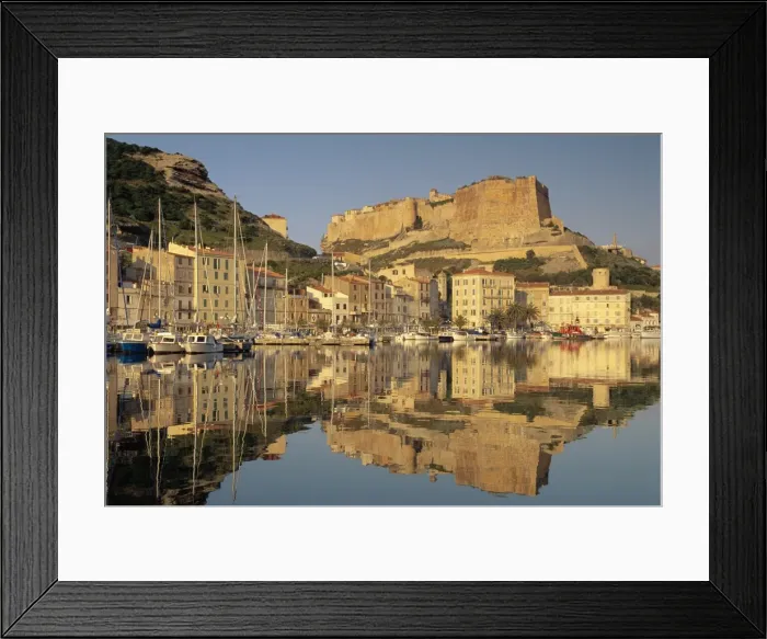 Framed Print : Yachts moored in the harbour, with the citadel behind, Bonifacio, Corsica Framed Print : Yachts moored in the harbour, with the citadel behind, Bonifacio, Corsica