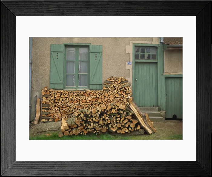 Framed Print : Logs piled outside a traditional cottage with shutters at the window, at Meuse Framed Print : Logs piled outside a traditional cottage with shutters at the window, at Meuse