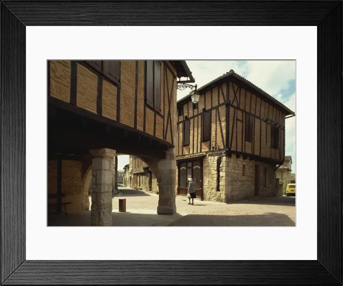 Framed Print : Street scene with timbered houses, Castelnau de Montmirail, Tarn, Midi-Pyrenees Framed Print : Street scene with timbered houses, Castelnau de Montmirail, Tarn, Midi-Pyrenees