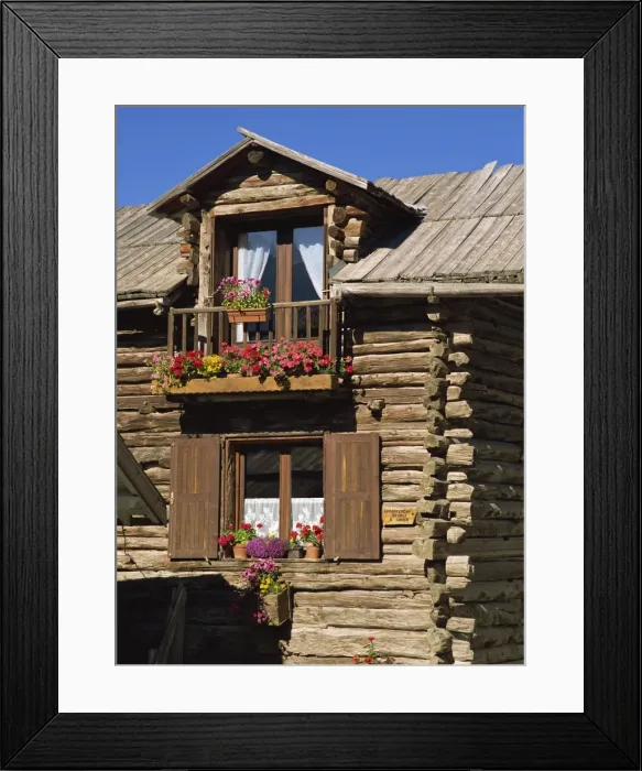 Framed Print : Close up of the exterior of a wooden house with window boxes in St. Veran in the Haute Alpes in Provence Framed Print : Close up of the exterior of a wooden house with window boxes in St. Veran in the Haute Alpes in Provence
