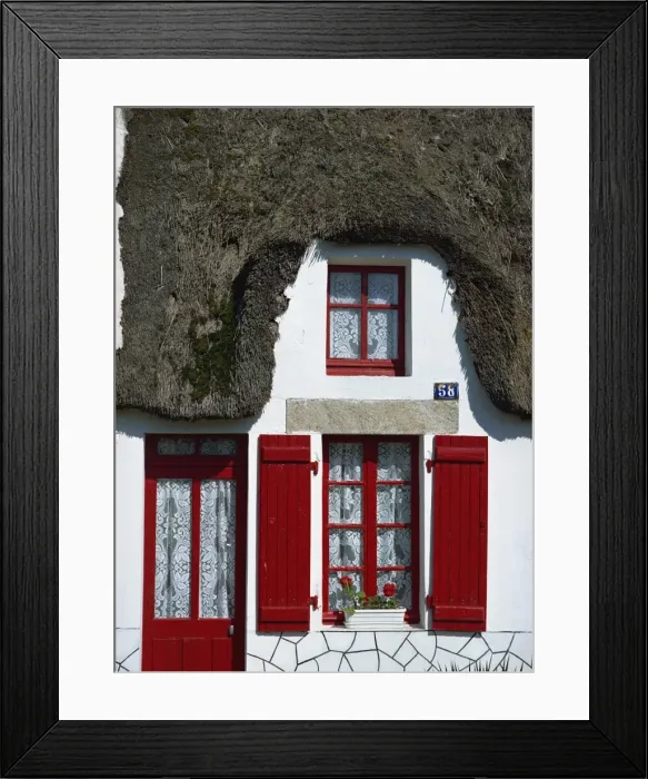 Framed Print : Exterior of a thatched cottage with red door and shutters in La Grande Briere Framed Print : Exterior of a thatched cottage with red door and shutters in La Grande Briere