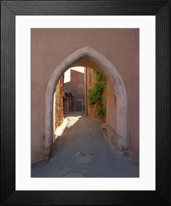 Framed Print : Pink arch over a narrow empty street in the village of Roussillon, Vaucluse Framed Print : Pink arch over a narrow empty street in the village of Roussillon, Vaucluse