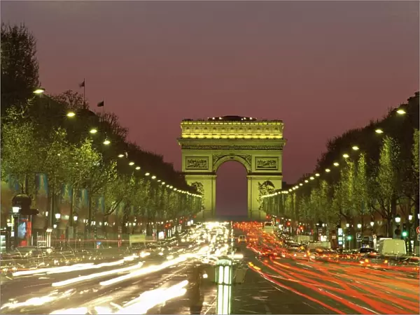 Avenue des Champs Elysees and the Arc de Triomphe at night, Paris, France, Europe