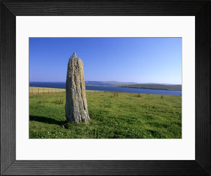 Framed Print : Standing stone near Clivocast (Uyeasound), looking east towards Fetlar in distance Framed Print : Standing stone near Clivocast (Uyeasound), looking east towards Fetlar in distance