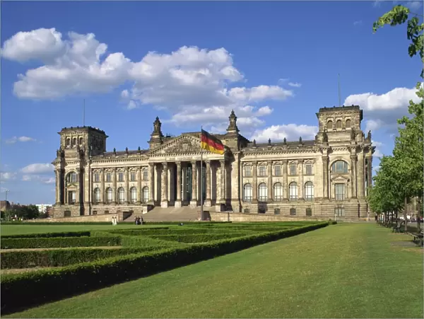 The German flag flies in front of the Reichstag in Berlin