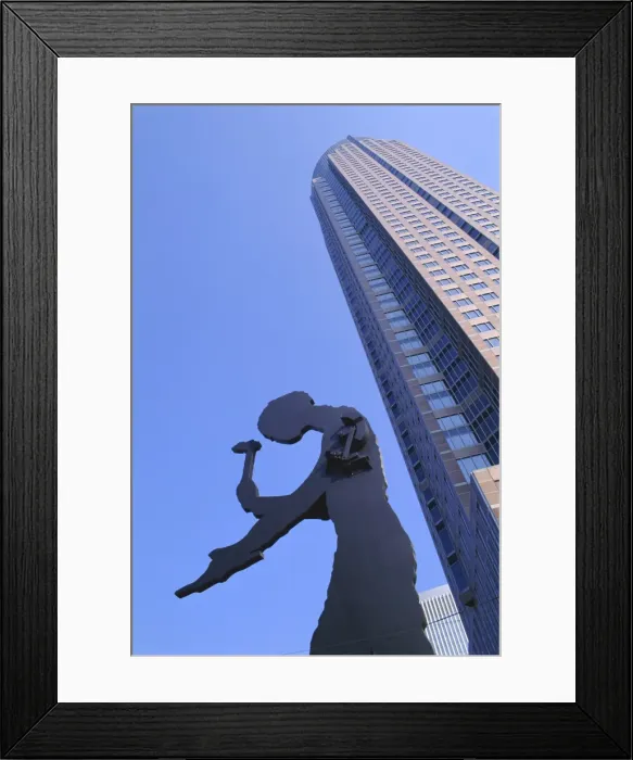 Framed Print : Hammering Man statue and Fair Tower Framed Print : Hammering Man statue and Fair Tower