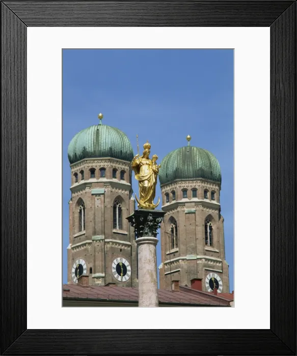 Framed Print : Gilded statue in the Marienplatz and towers of Framed Print : Gilded statue in the Marienplatz and towers of