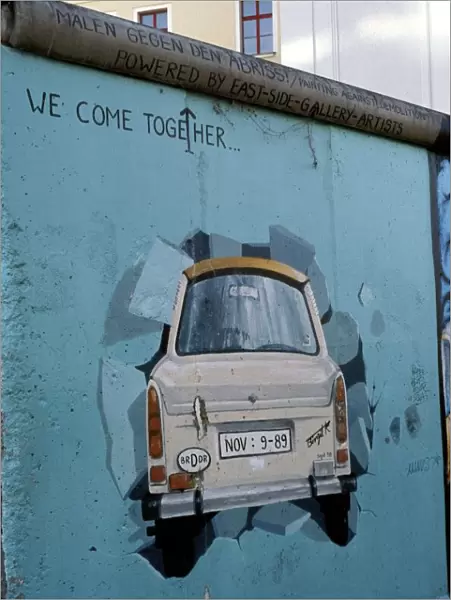 A Trabant car painted on a section of the Berlin Wall