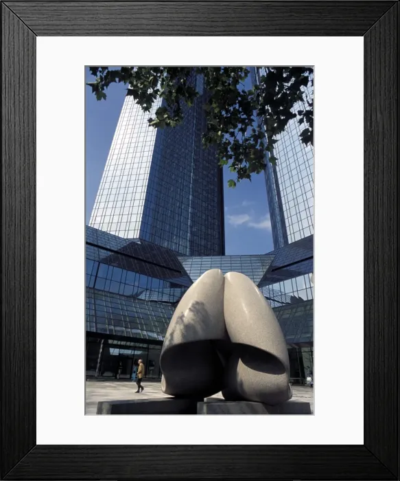 Framed Print : Modern statue in the square between skyscrapers Framed Print : Modern statue in the square between skyscrapers
