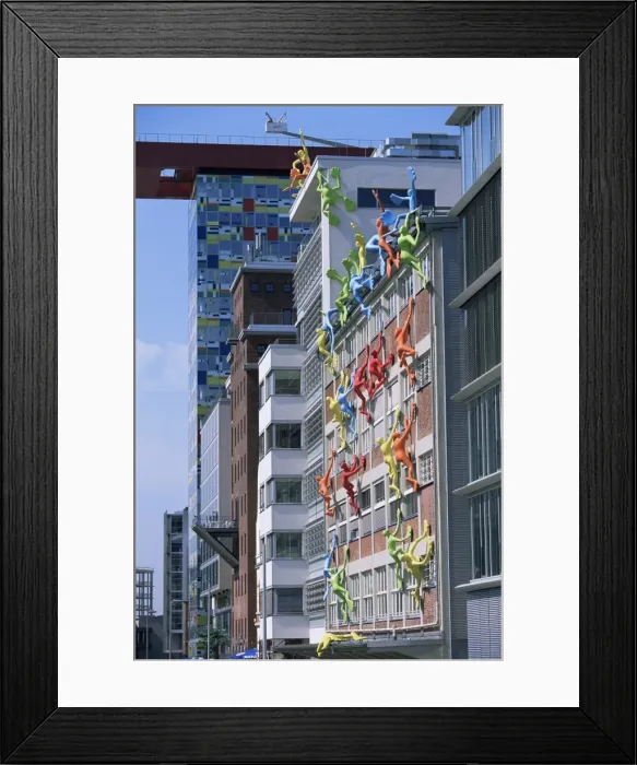 Framed Print : Flossies figures covering a building facade at the Medienhafen Framed Print : Flossies figures covering a building facade at the Medienhafen