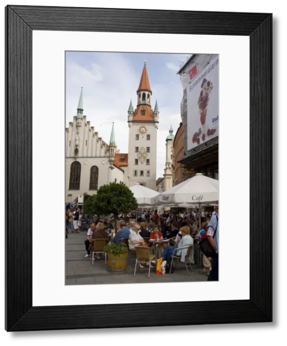 Framed Print : People sitting at an outdoors cafe in front of the old city hall Framed Print : People sitting at an outdoors cafe in front of the old city hall