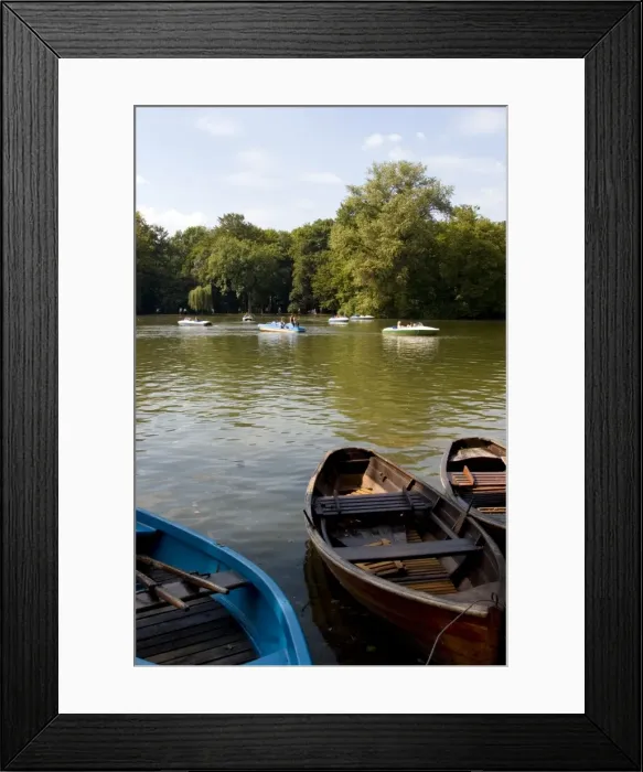 Framed Print : People cruising in a boat on the Kleinhesselohe lake Framed Print : People cruising in a boat on the Kleinhesselohe lake