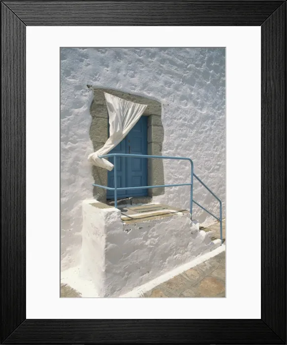 Framed Print : Close-up of stairs with blue rail and door of a whitewashed Framed Print : Close-up of stairs with blue rail and door of a whitewashed