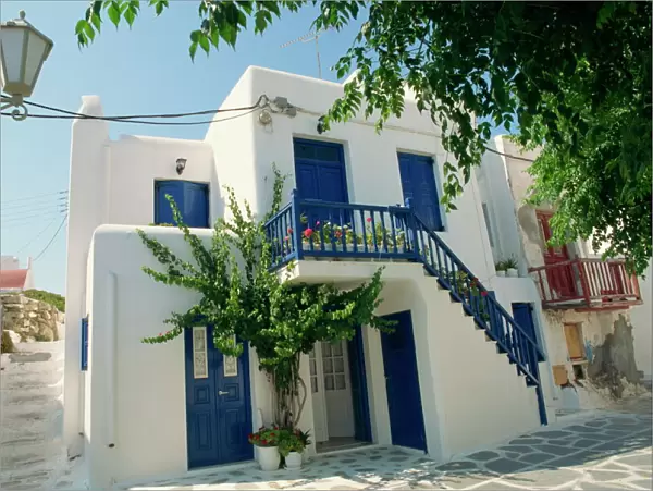 White house with blue doors and shutters on Mykonos