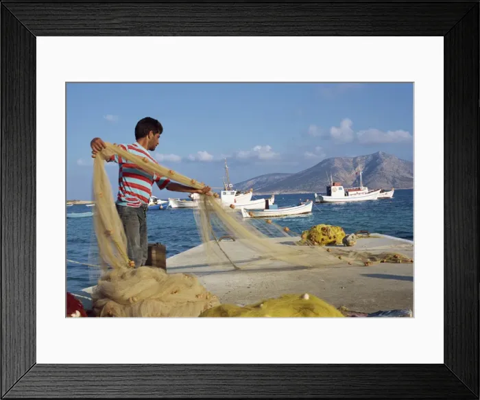 Framed Print : Fisherman sorting his nets Framed Print : Fisherman sorting his nets