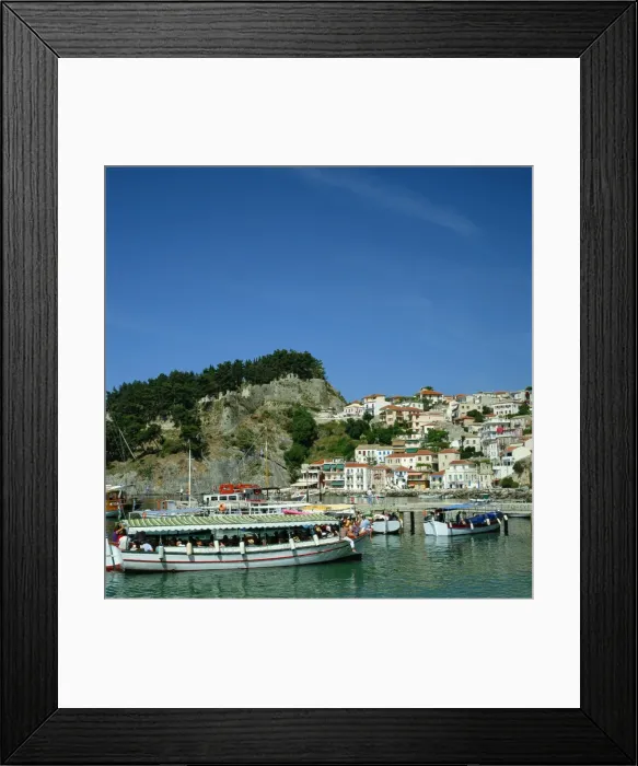 Framed Print : Tourist boats and the town of Parga in the background Framed Print : Tourist boats and the town of Parga in the background