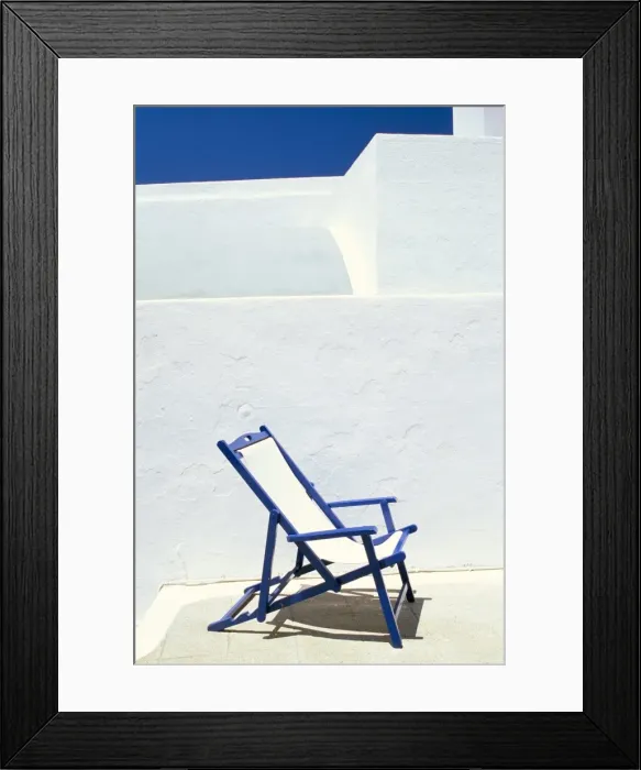 Framed Print : Deckchair against whitewashed wall Framed Print : Deckchair against whitewashed wall