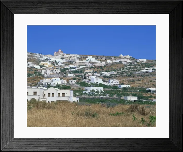 Framed Print : White buildings in village on a hillside with church on skyline Framed Print : White buildings in village on a hillside with church on skyline