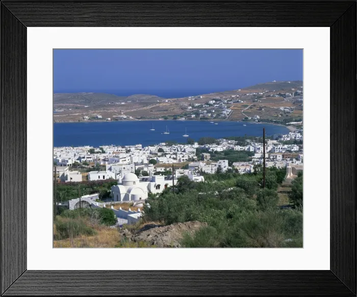 Framed Print : White church and houses overlooking a bay on Paros Framed Print : White church and houses overlooking a bay on Paros