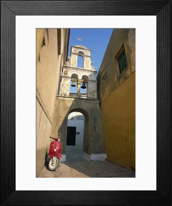 Framed Print : Red scooter parked beneath a bell tower in a back street Framed Print : Red scooter parked beneath a bell tower in a back street
