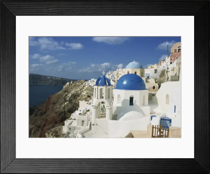 Framed Print : View over the blue domes and white houses of the village of Oia Framed Print : View over the blue domes and white houses of the village of Oia
