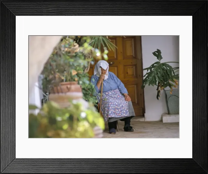 Framed Print : Old woman dozing at monastery Framed Print : Old woman dozing at monastery