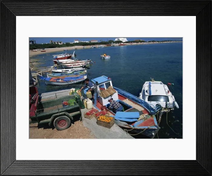 Framed Print : Boxes of tomatoes and oranges on quay as supply boat Framed Print : Boxes of tomatoes and oranges on quay as supply boat